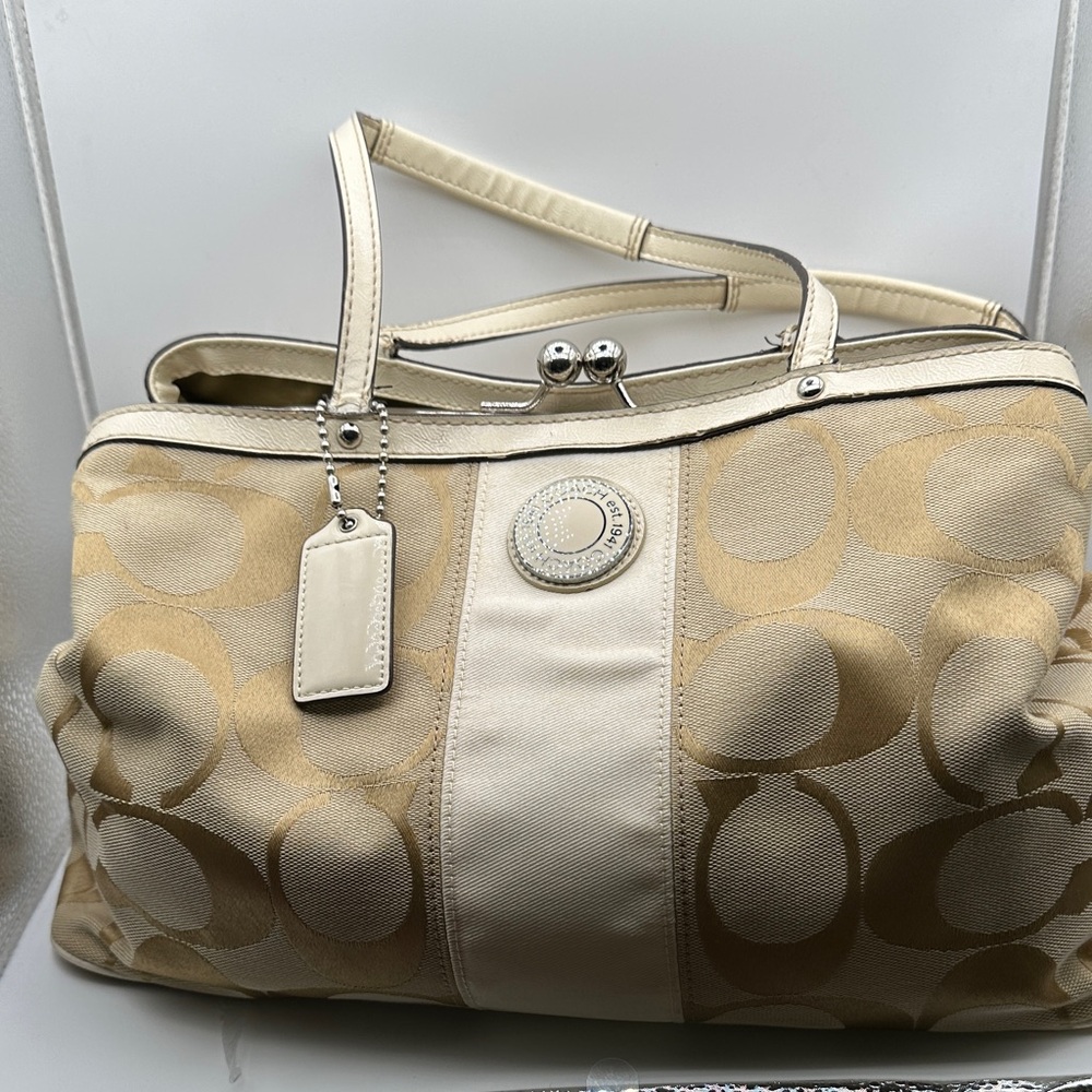 Coach  Cream and Gold Women's kiss lock Bag with two hang tags. EUC
